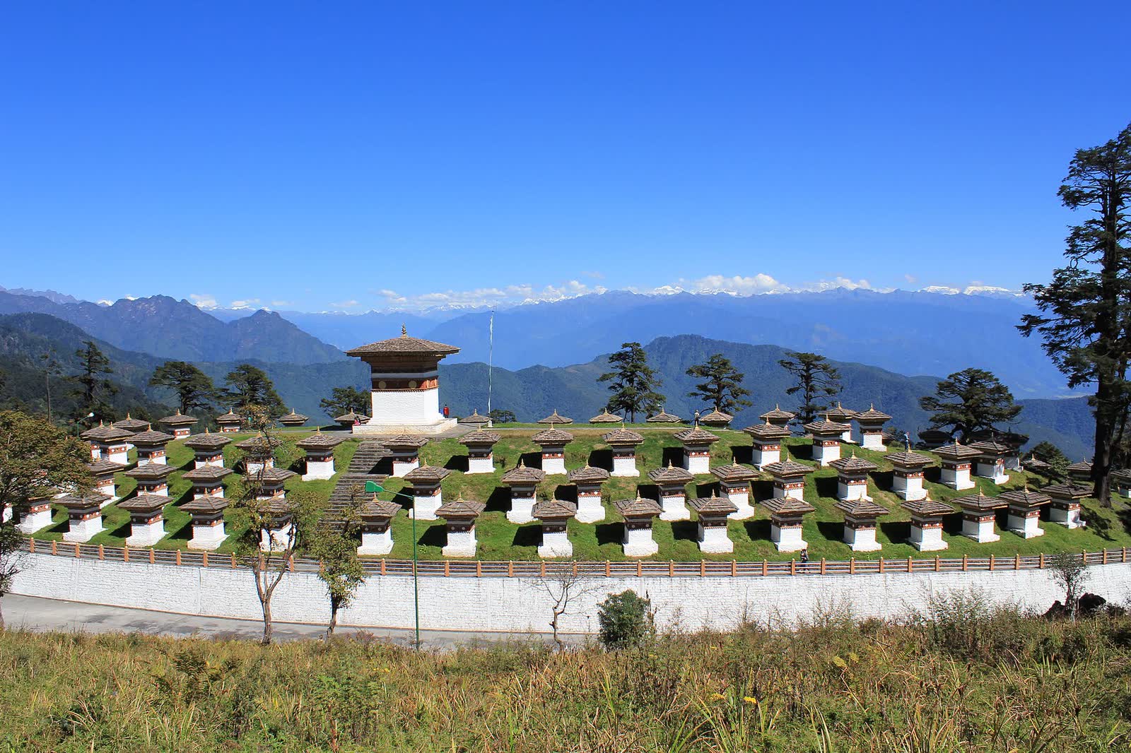 The 108 chortens of Dochula pass, with the Himalaya beyond